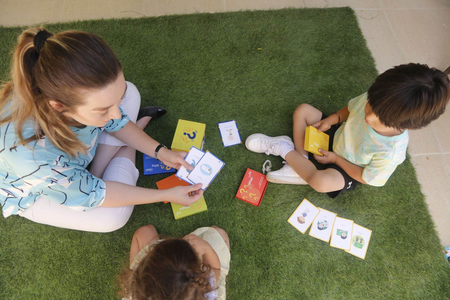 kids and parent playing flashcard games to enhance speech skills