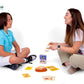 A parent and a kid playing together with the flashcard game R Sound therapy cards.